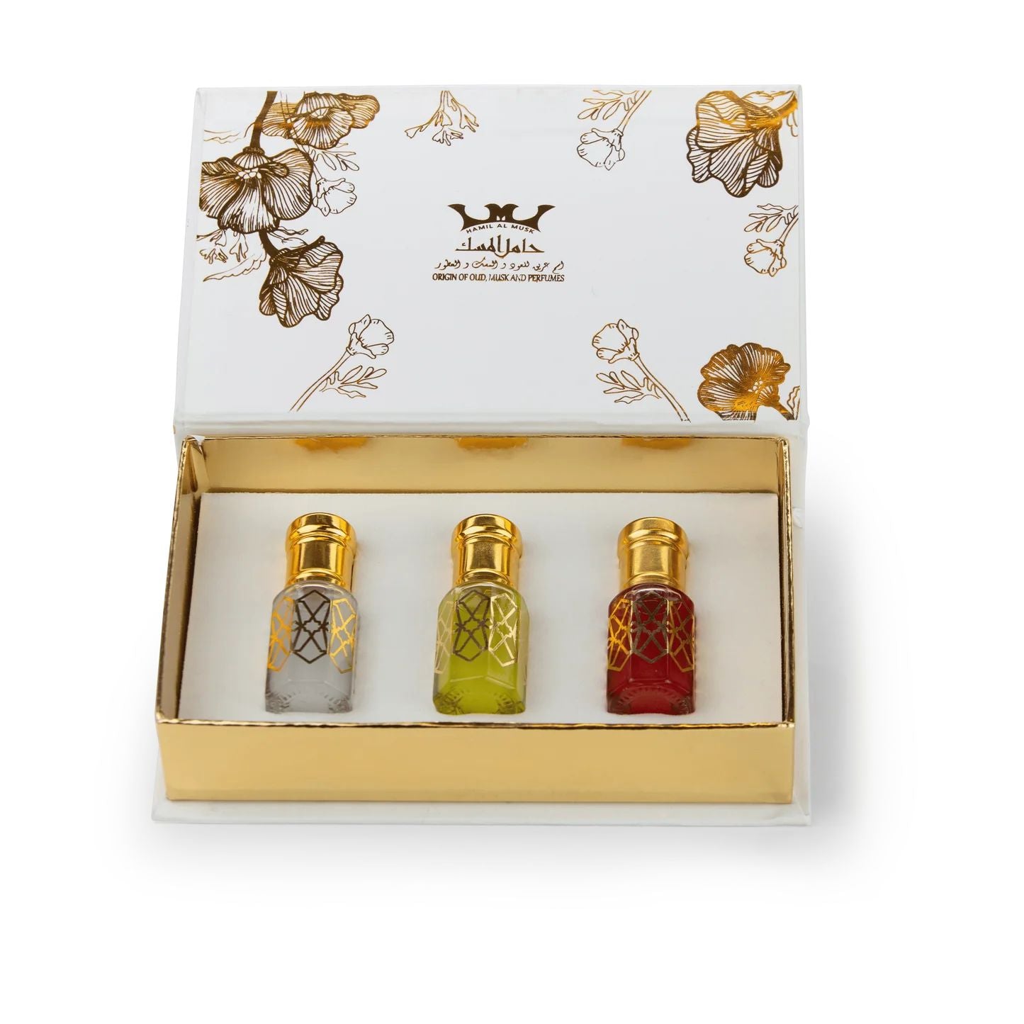 Three small bottles of perfume in a decorative box with floral patterns and a brand logo.
